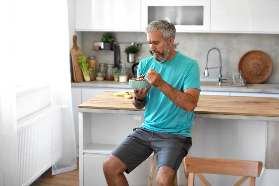 Senior man eating healthy meal